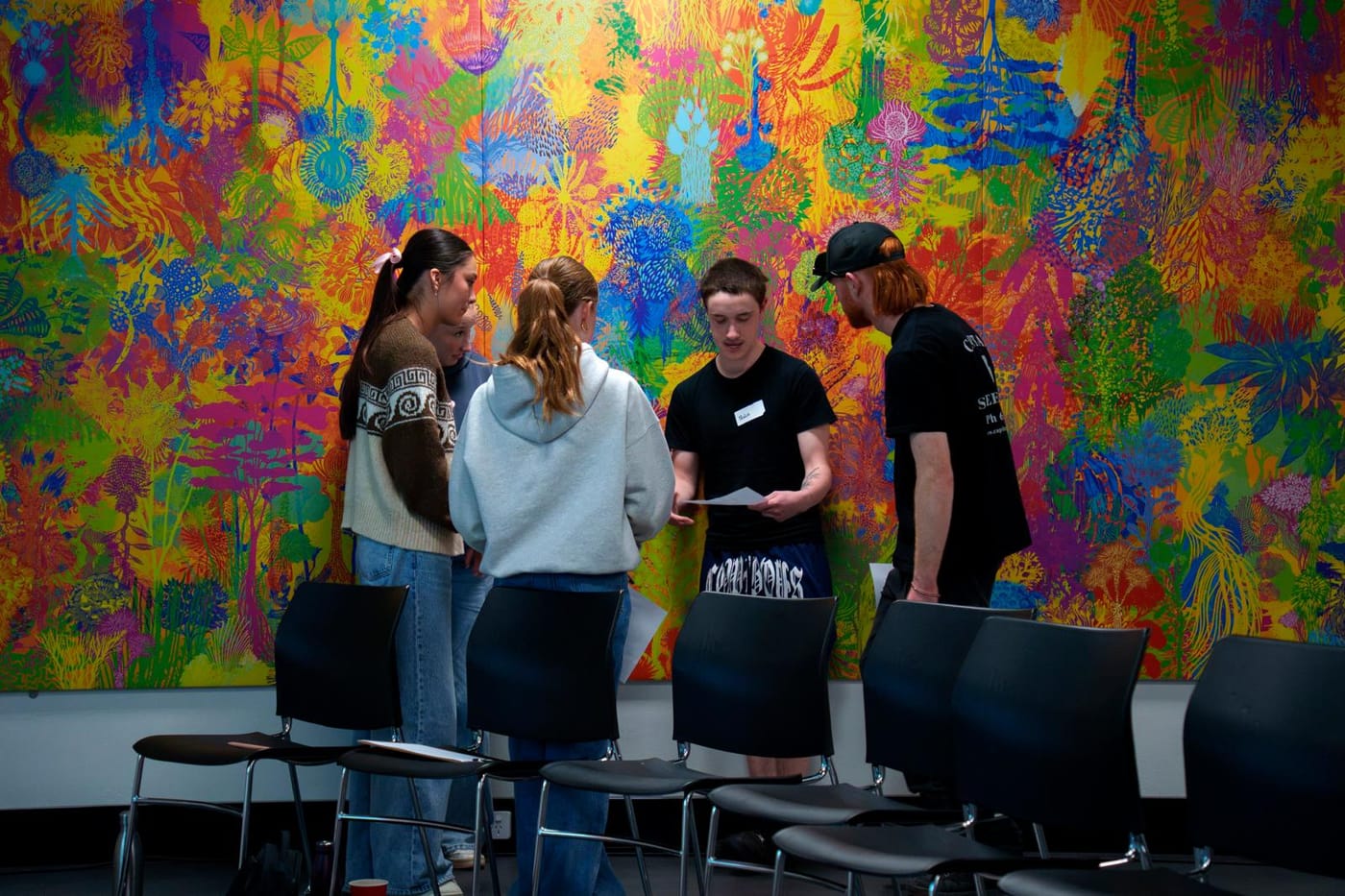 Young people talking together at a session