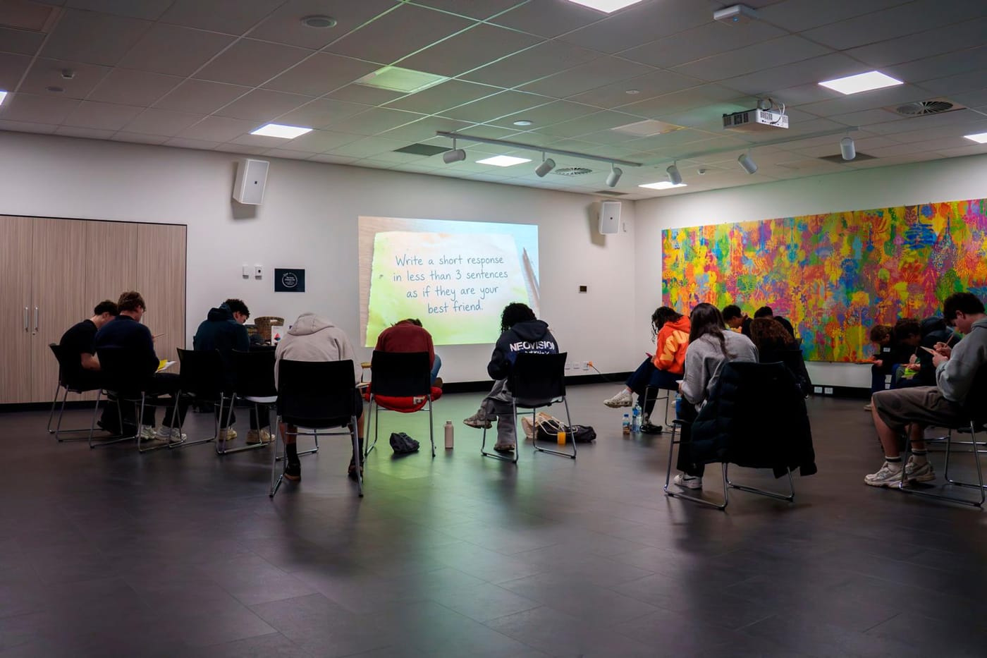 A session in progress — a facilitator and a group of young people